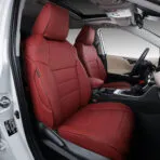 Red custom-fit leather seat covers installed on Toyota RAV4 front seats.