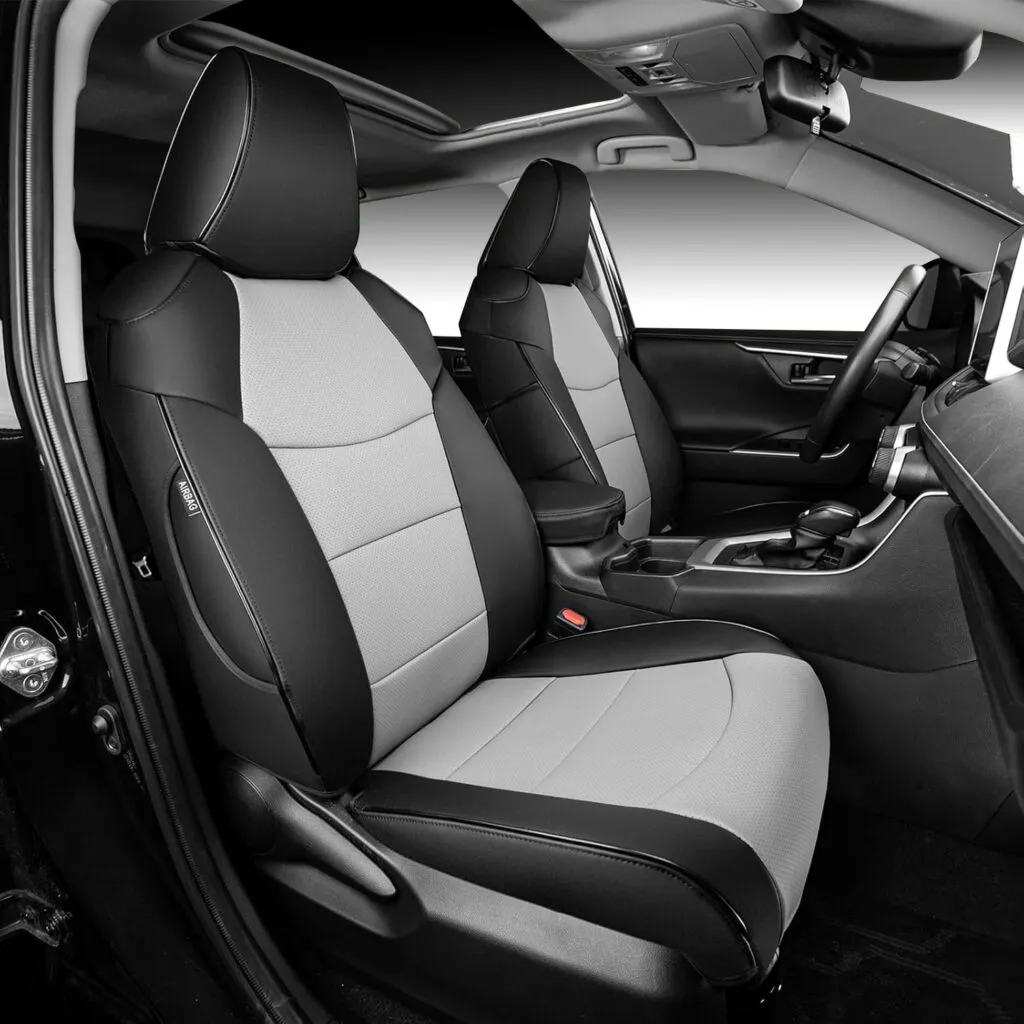 Black and gray custom-fit leather seat covers installed on Toyota RAV4 front seats.