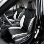 Black and white custom-fit leather seat covers installed on Toyota RAV4 front seats.