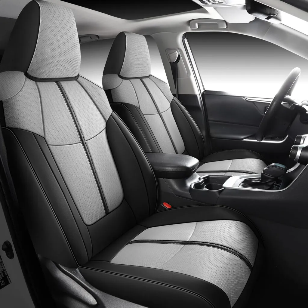 Black and gray custom-fit leather seat covers installed on Toyota RAV4 front seats.