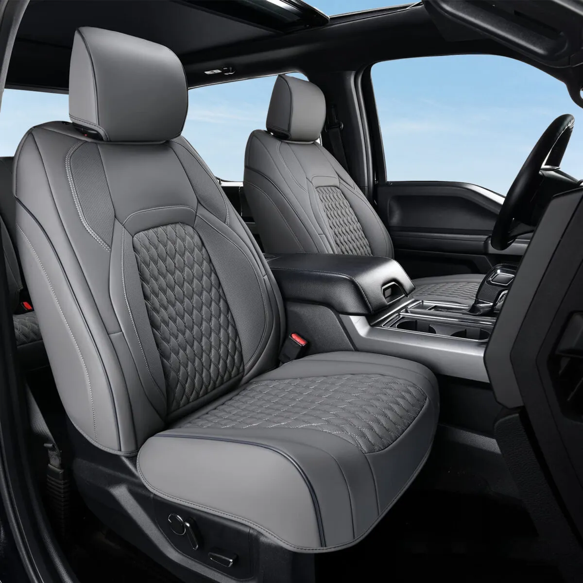 Gray custom-fit all-inclusive leather seat covers with quilted design installed on front seats of Ford F-150 SuperCrew.