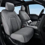 Gray custom-fit all-inclusive leather seat covers with quilted design installed on front seats of Ford F-150 SuperCrew.